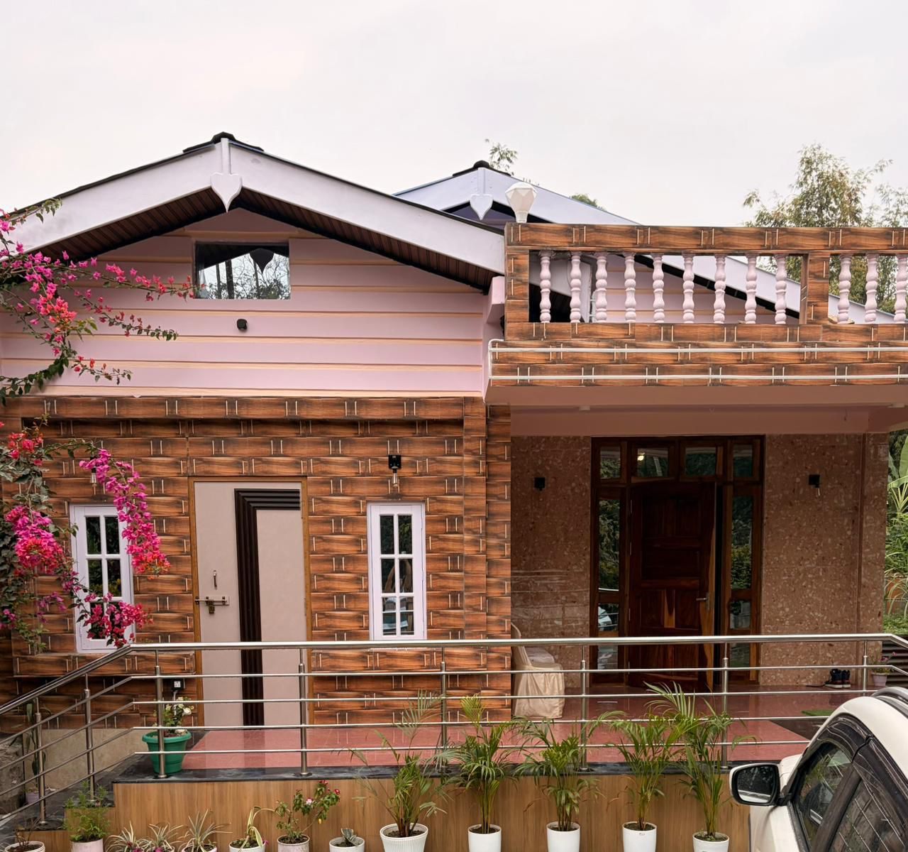 Front elevation with balcony & landscaping — The Silapathar Residence, Silapathar, Assam