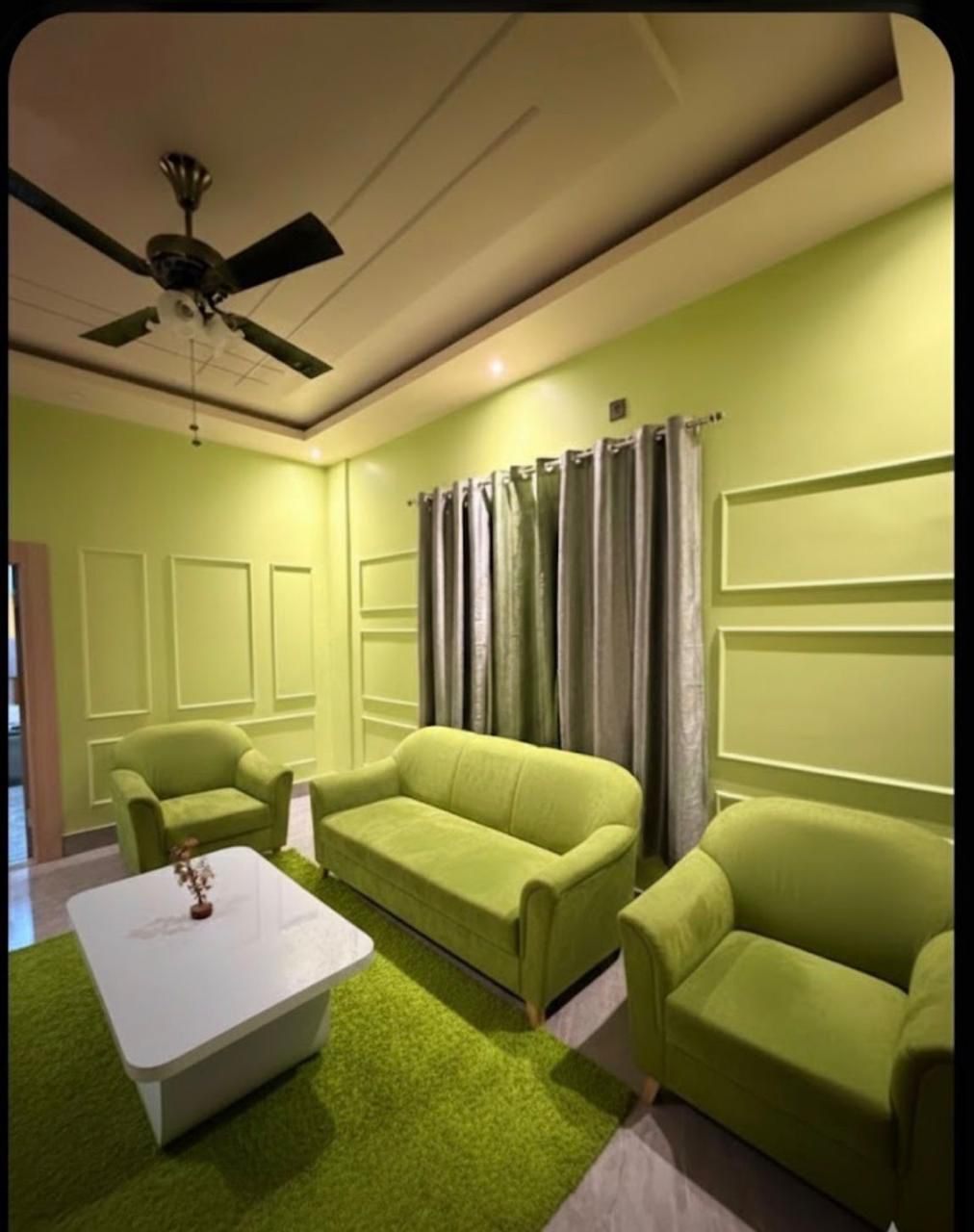 Living room with false ceiling & wall panelling — The Silapathar Residence, Silapathar, Assam
